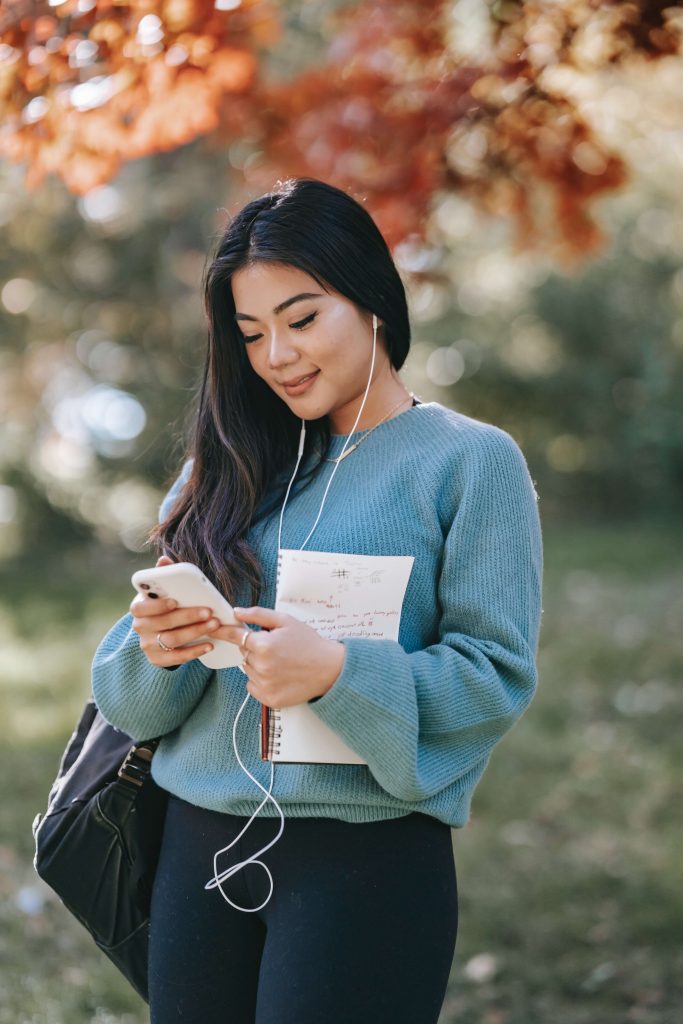 A woman listening and writing in Spanish so as not to forget the language